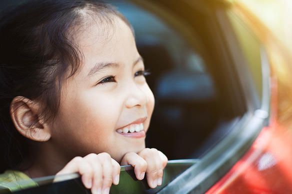 girl smiling in a car
