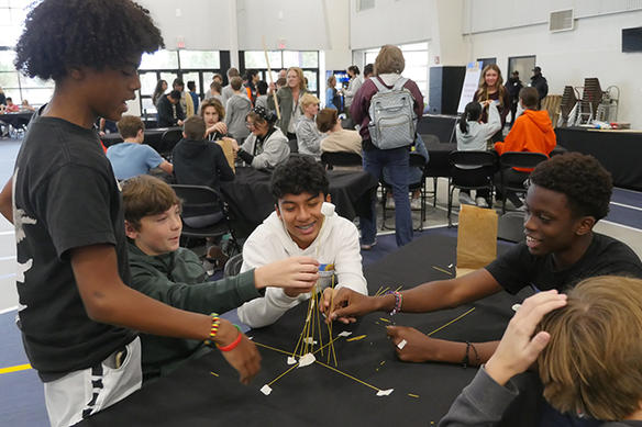Students work together on a project at STEM Fest, a weekend of interactive experiences, educational activities, guest speakers and informational exhibits in Overland Park, KS