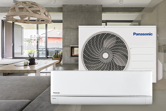 A Panasonic HVAC combo unit with a home in the background