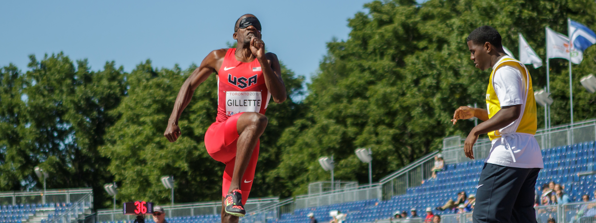 Lex Gillette prepares to transition from the run-up to the take-off of his long jump