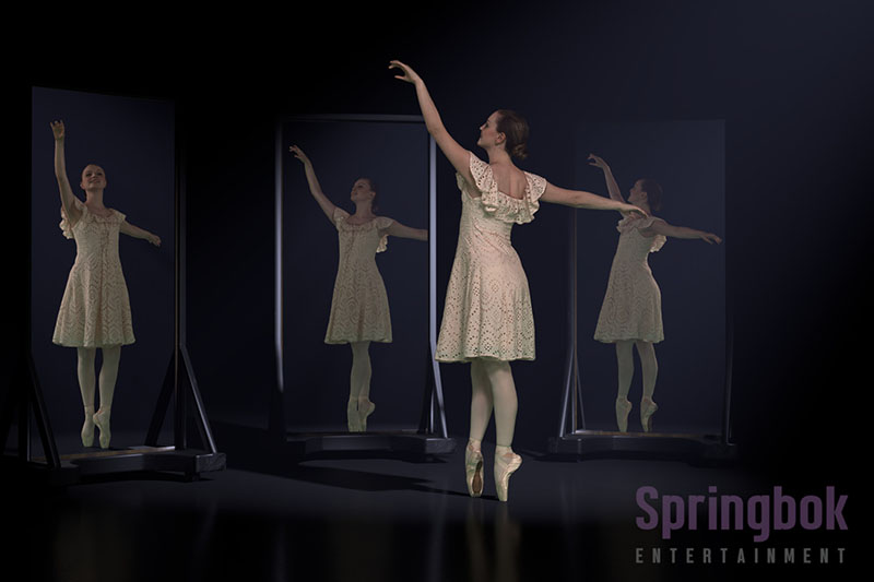 Ballerina dancing in front of three mirrors showing her reflection