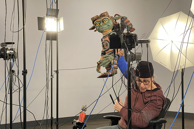 Puppet, controlled by puppeteer, being captured in Springbok volumetric studio