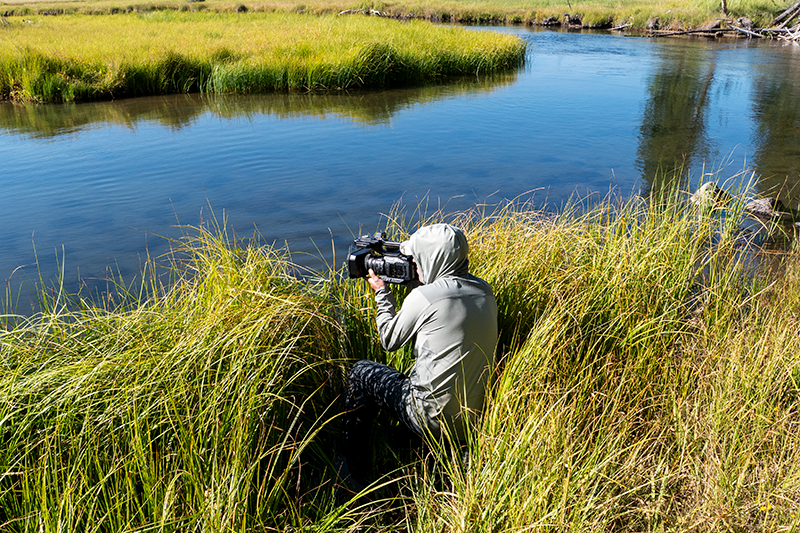 Filmmaker Todd Moen shooting handheld with the X2 by a river