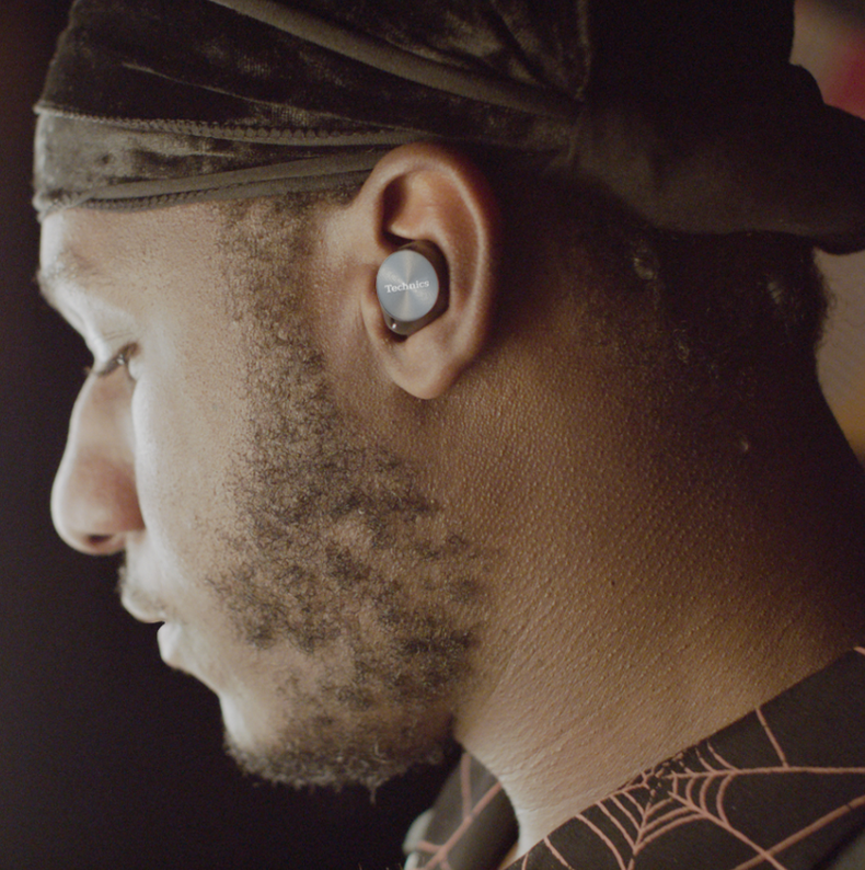 Leon Bridges wearing Technics true wireless earbuds