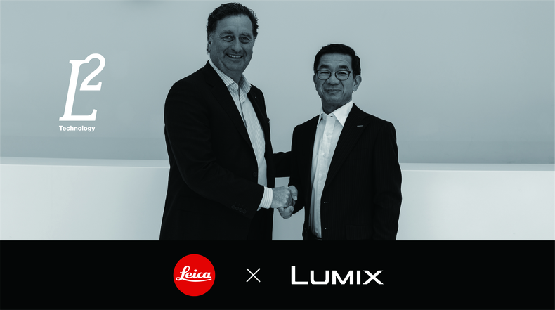 Matthias Harsch, CEO of Leica Camera AG, shakes hands with Yosuke Yamane, Vice President of Panasonic Entertainment & Communication Co., Ltd