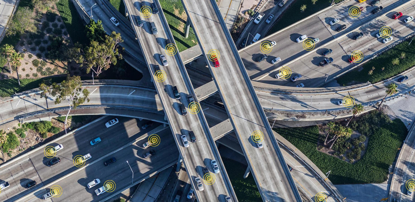 a bird's-eye view of cars as they move down the high way