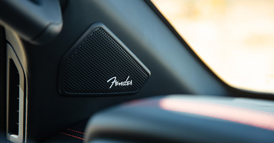 Close-up shot of a Fender speaker inside a Nissan Titan Pro 4x
