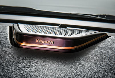 Close-up of Klipsch Premium audio speaker on car dashboard
