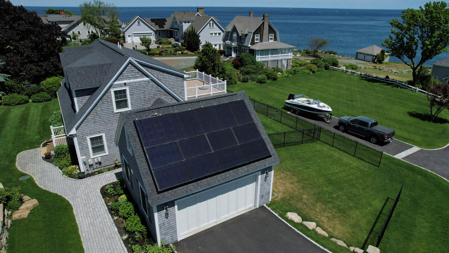 FILE PHOTO: Solar panels create electricity on the roof of a house in Rockport
