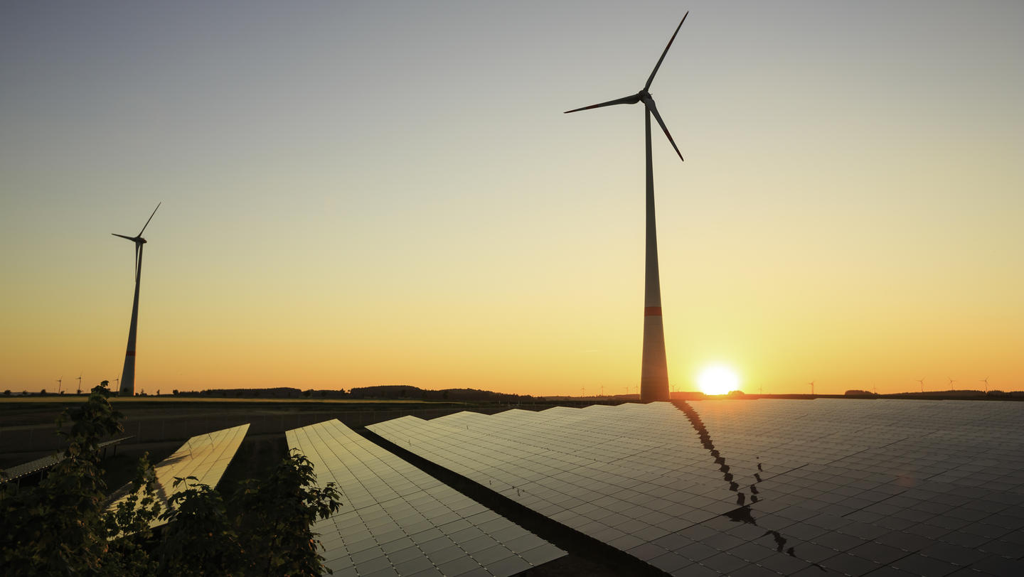 renewable energy: wind turbines and modern solar panels