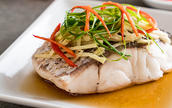 steamed fish with julienned chives, carrots