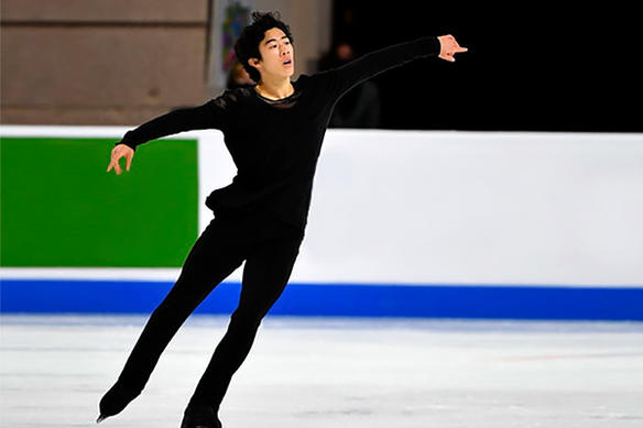 Figure skater Nathan Chen glides across the ice
