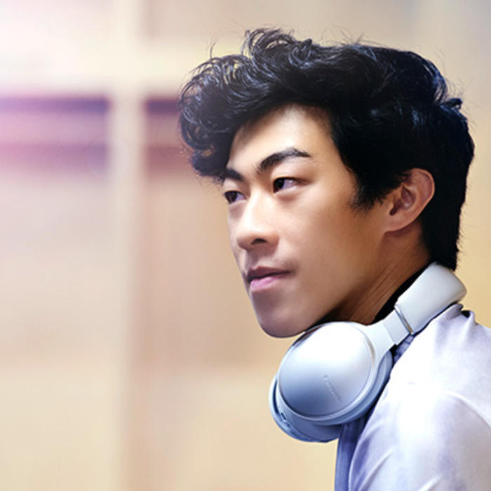 Nathan Chen takes a moment to relax and listen to music on headphones