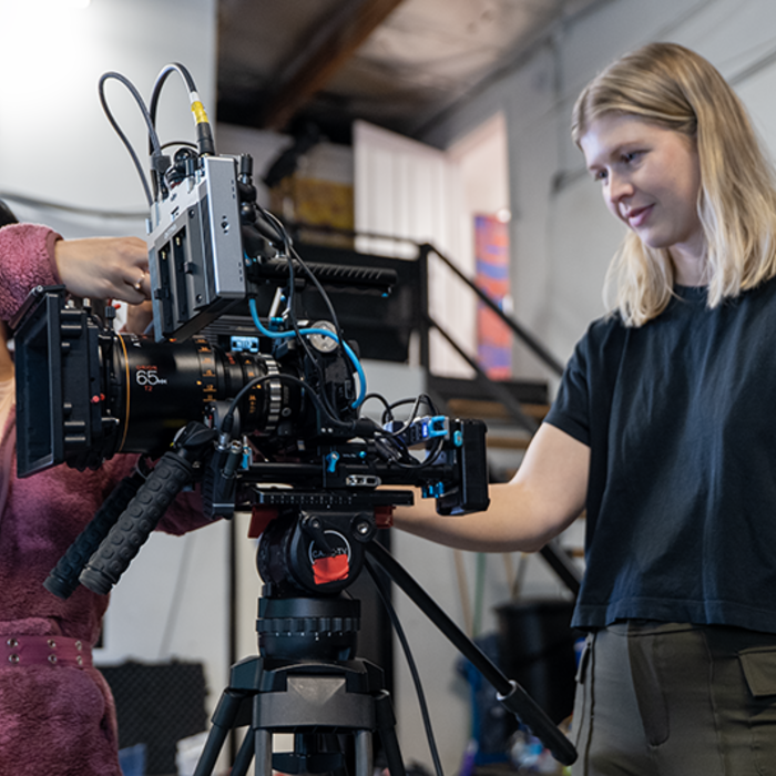 Camera assistant adjusting cable and DP Carissa Dorson checking the frame