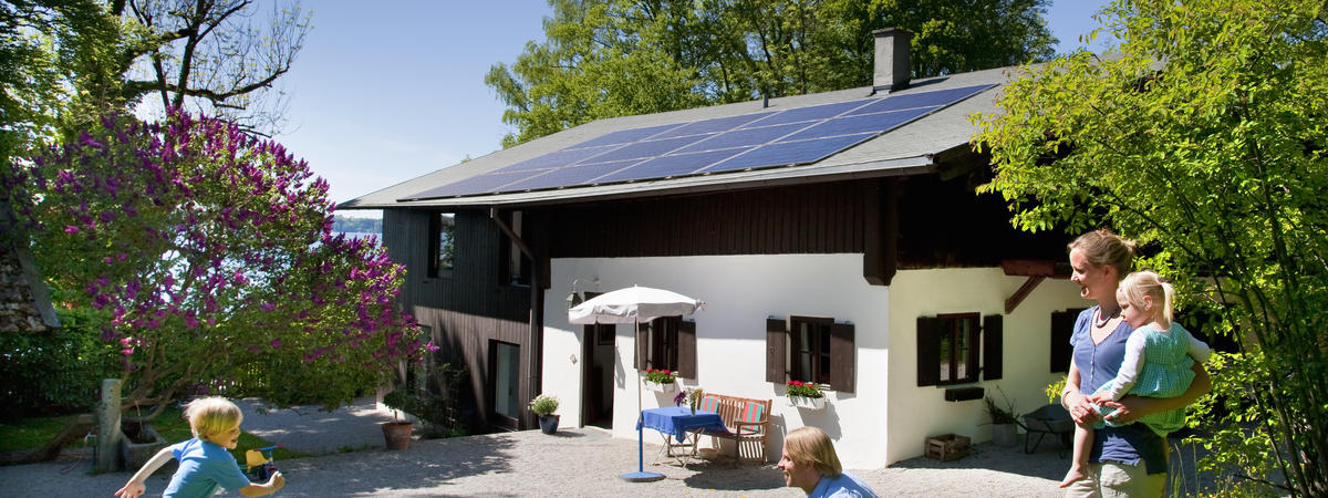 Family at home with solar panel