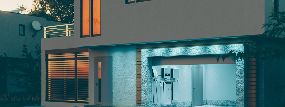 concept of a home battery energy storage system located in the garage of a modern family house in a futuristic blue light illuminating the evening atmosphere of a quiet street. 3d rendering.