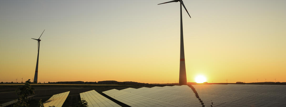 renewable energy: wind turbines and modern solar panels