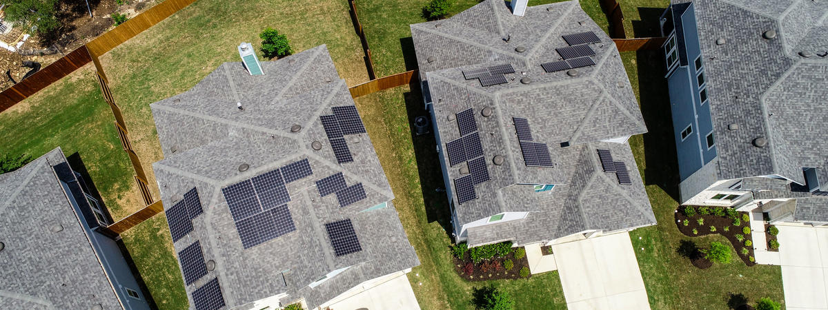solar panel homes at New urban Suburb development North Austin homes and grey modern rooftops