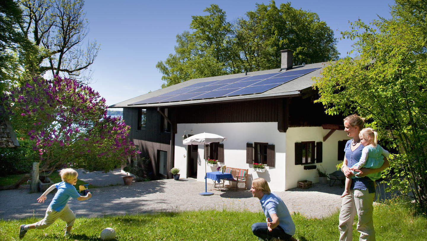 Family at home with solar panel